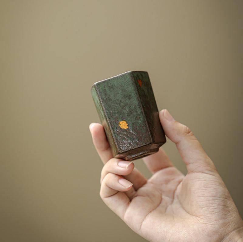 Ceramic-Mini-Cups-with-Golden-Flakes-in-hand-green