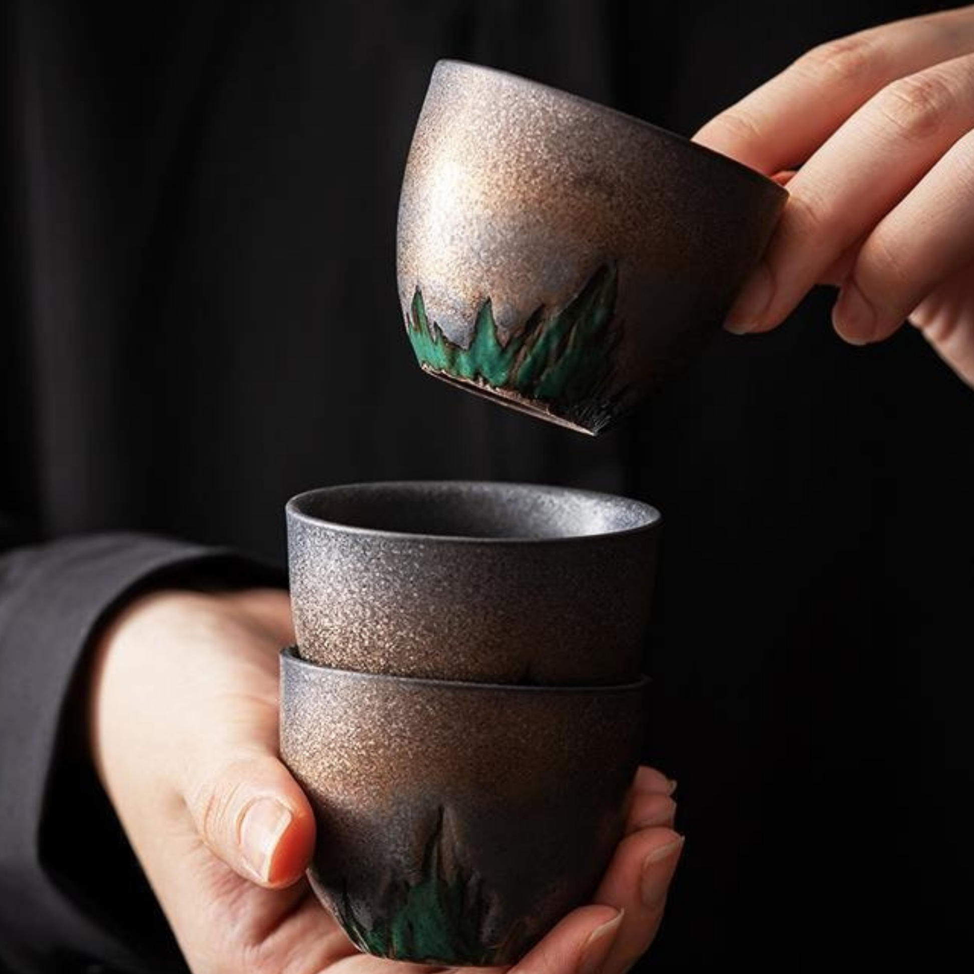 Gilt-Ceramic-Cups-in-hands