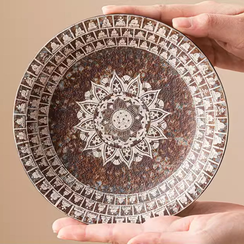 Kiln-Transmuted-Ceramic-Trays-with-Silver-Detailing-and-Mythology-Motifs-in-hands