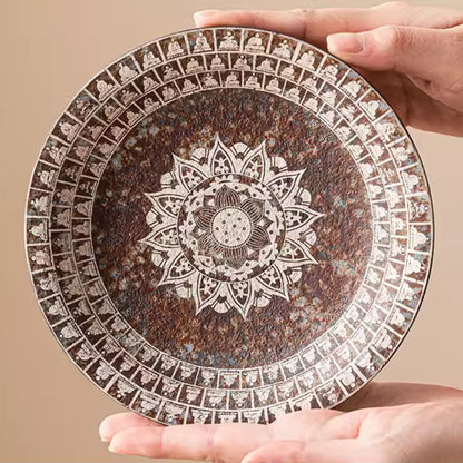 Kiln-Transmuted-Ceramic-Trays-with-Silver-Detailing-and-Mythology-Motifs-in-hands