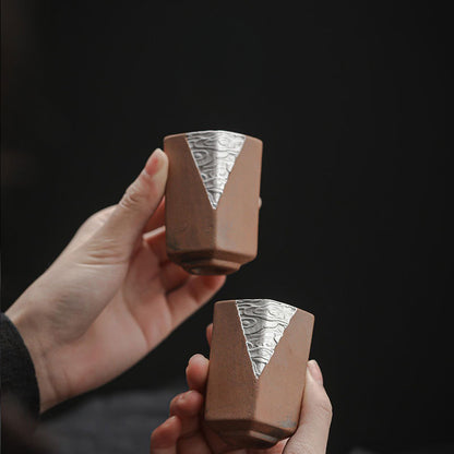 Silver-Detailing-Pottery-Cups-in-hands