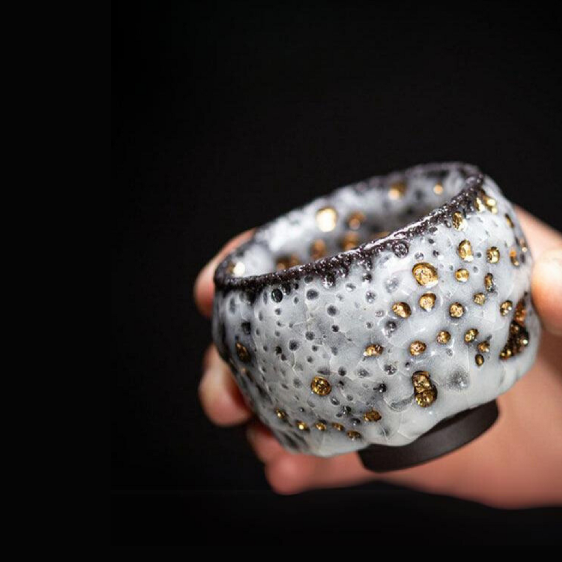 aureatoir.com-Crackled-Ceramic-Cup-with-Gold-Detailing-in-hand