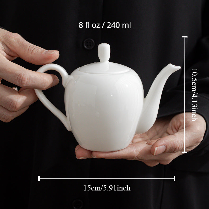 Mutton-Fat Porcelain Slouch Shoulder Teapot holding by hands