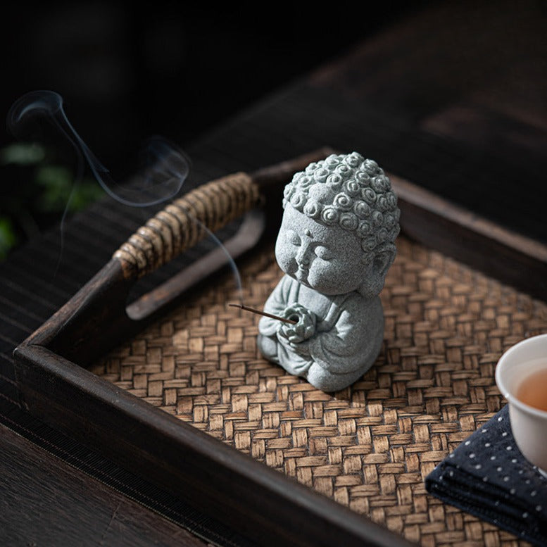 Sandstone Buddha Decor Incense Holder holding a burning incense