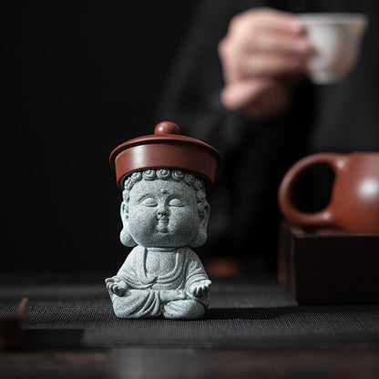 Sandstone Buddha Decor Incense Holder with a purple clay teapot lid on top of the buddha's head like a hat